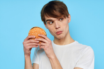 man in white t-shirt hamburger diet food snack lifestyle