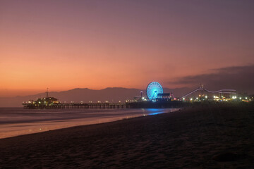 Fototapeta na wymiar The Santa Monica Pier at sunset, Los Angeles, California.