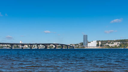 View of the big bridge across the Volga near the city of Saratov on a bright sunny day