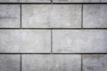 Grey grungy concrete wall rectangular tiles