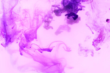 Fototapeta na wymiar Beautiful ink mix macro. Pink, purple, violet, white colors watercolor pouring. Paint movement macro. Fluid art painting. Moving flowing stream of liquid paint. Decorative abstract background.