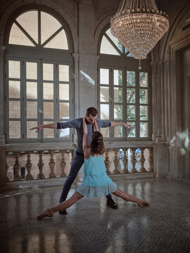 Couple performing ballet positions