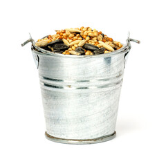 bird food seeds in a bucket isolated on a white background.