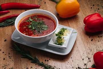 Traditional Ukrainian Russian borscht . Bowl of red beet root soup borsch with white cream . Beet Root delicious soup . Traditional Ukraine food cuisine
