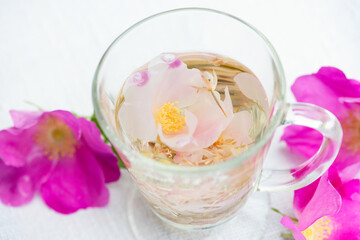 Herbal rose tea in the glass cup