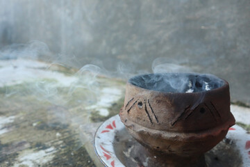a place to burn incense made of clay and produce a pungent-scented smoke, commonly used for...