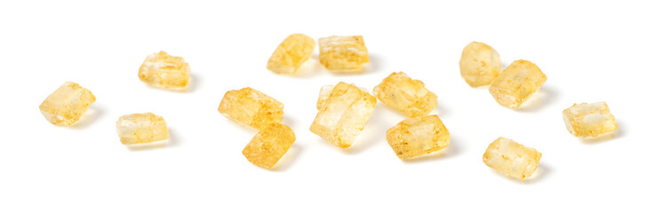 close up of yellow sugar crystal isolated on white background