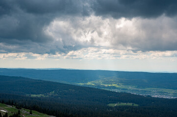 dramatic light over the hills of jura vaudoise near Col de Marchairuz