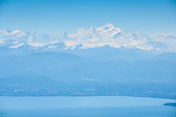 Papier peint photo autocollant rond Mont Blanc Mont Blanc behind Lake Geneva seen from great distance from the jura vaudoise