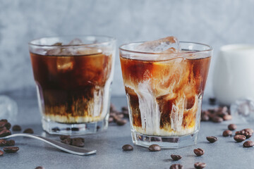 Iced coffee with ice cubes in glass
