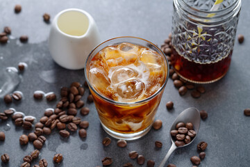 Iced coffee with ice cubes in glass