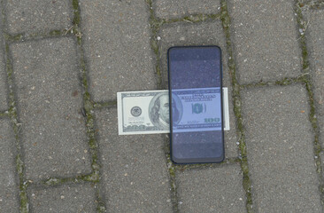 100 usd Banknotes view through smartphone.