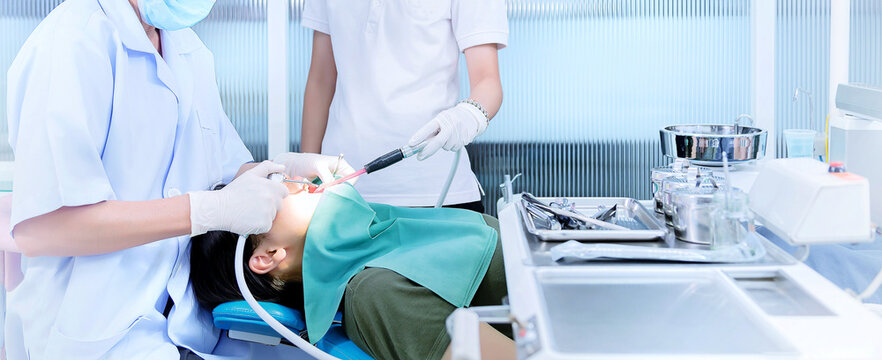  Dentist treats teeth for patients