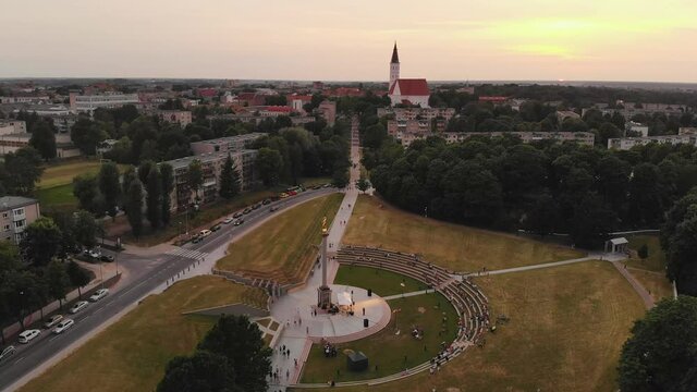 Siauliai, LITHUANIA - JUNE 23: rural folk band perform with variety of instruments in main city landmark surrounded by people. 4K UHD