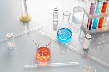 View from above.Laboratory glass table and different kinds of glassware,colorful chemical liquids on it