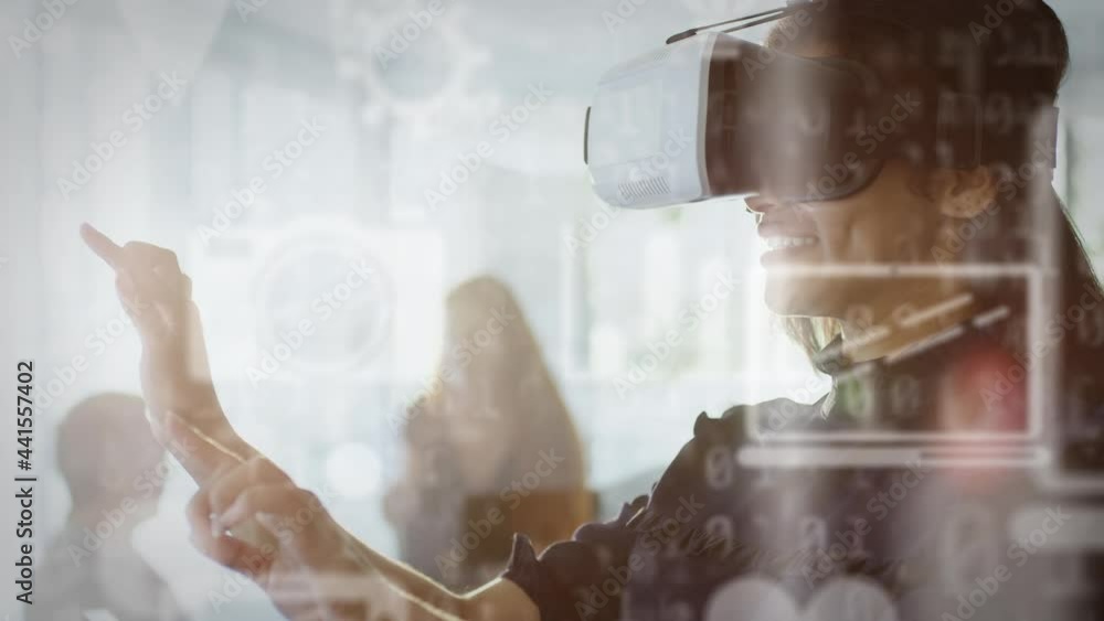 Poster multiple digital icons and binary coding against businesswoman wearing vr headset at office