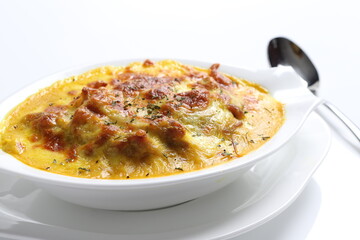 oven baked creamy cheese Japanese curry pasta with chicken in bowl western chef cuisine seafood...