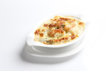 oven baked creamy cheese carbonara pasta with fresh big prawn in bowl western chef cuisine seafood menu in white and brown background