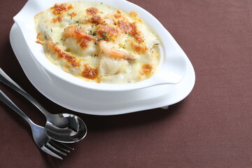 oven baked creamy cheese carbonara pasta with fresh big prawn in bowl western chef cuisine seafood...
