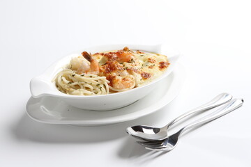 oven baked creamy cheese carbonara pasta with fresh big prawn in bowl western chef cuisine seafood...