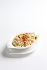 oven baked creamy cheese cabonala pasta with fresh big prawn in bowl western chef cuisine seafood menu in white and brown background