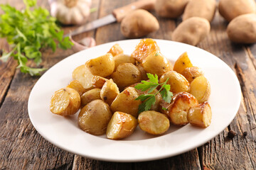 baked potatoes with parsley in plate