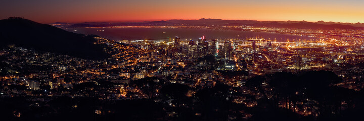 Golden hour panoramic of a winter sunrise over Cape Town in South Africa.