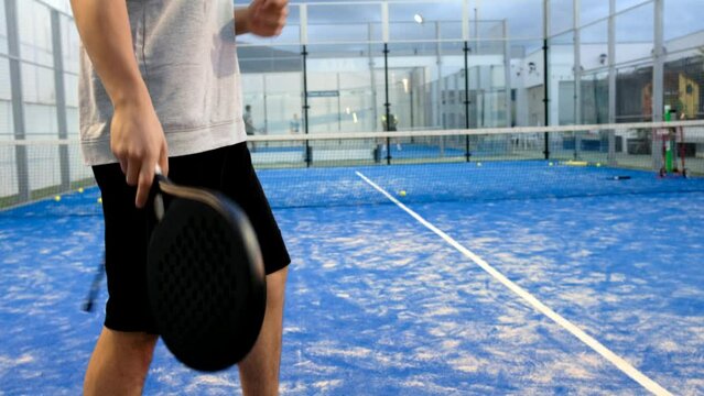 paddle tennis serve, training man in court