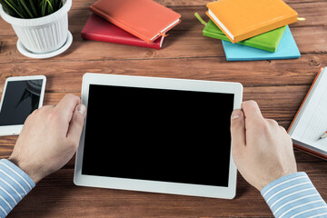 businessman with a tablet, works in the office