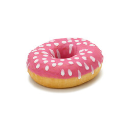 baked round donut with pink icing and white dots isolated on white background