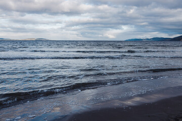 beautiful beach and Pacific Ocean view at dusk in Kingston Beach in Southern Tasmania in Australia