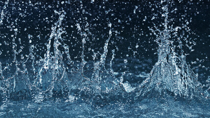 Abstract water splashes isolated on blue background