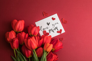 Festive floral invitation, greeting card Love you mom, background with summer spring flowers. Valentines day, mothers day, womens day, spring concept. Flat lay, top view, copy space