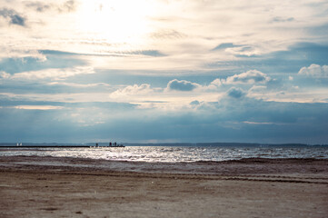 Dramatic sky at sunset with beach on foreground on Baltic sea in Germany