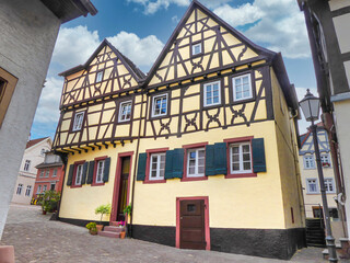 Fototapeta na wymiar Traditional yellow half-timbered house in Neckargemund, a small town in Baden-Wurttemberg in the south of Germany