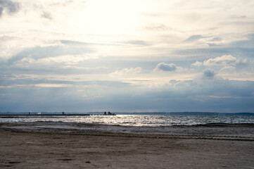 Dramatic sky at sunset with beach on foreground on Baltic sea in Germany