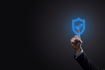 Protection network security computer in the hands of a businessman. business, technology, cyber security and internet concept - businessman pressing shield button on virtual screens Data protection