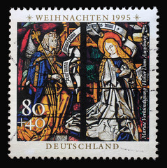 A stamp printed in Germany shows the Annunciation, Stained glass windows in Augsburg Cathedral, circa 1995