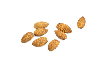 Almond nuts isolated on white background. Heap of scattered almonds