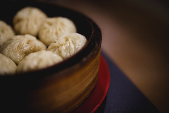 Xiaolongbao in bamboo basket in Asian cafe