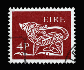 A stamp printed in Ireland shows Stylised Dog, 7th Century Brooch, Early Irish Art, circa 1969