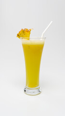 Pineapple Juice in a glass with a piece of pineapple