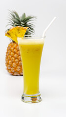 Pineapple Juice in a glass with a piece of pineapple
