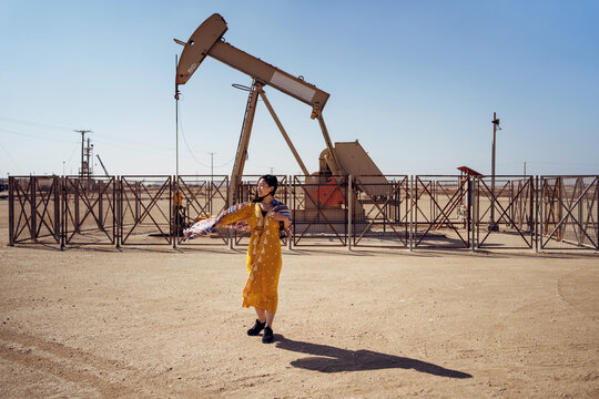 woman standing on oil field