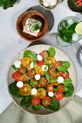 Composition with salad and cocktail with mint.