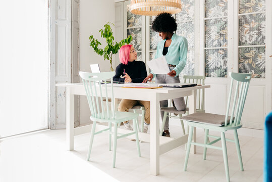 Creative female designers working at home