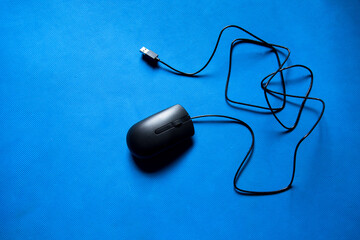 Top view of a modern computer mouse on a background with use of selective focus