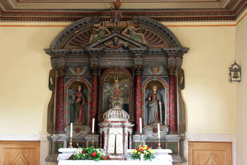 Fototapeta na wymiar The main altar in the parish church of Our Lady of Mount Carmel in Bacva, Croatia