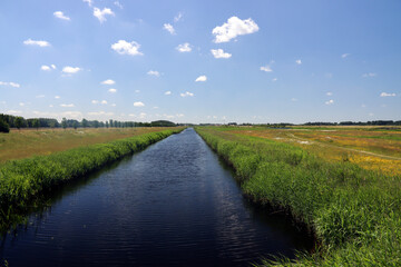 Fototapeta na wymiar meadows, roads and canals in water storage Eendragtspolder in Zevenhuizen