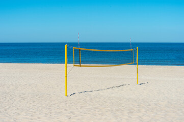 Beach volleyball court with an ocean background. Summer sport concept